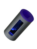The Lelo F1S V2X Vibrating Masturbator in blue is shown against a blank background. The toy is cylindrical with a grey outside and a blue cap on one end. There is a window to the inside of the toy, which is dark blue.