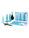 The contents of the b-Vibe Anal Training & Education Butt Plug Set in Aqua are shown against a blank background. The box is shown along with the 3 plugs, a black enema bulb and lube shooter, and a guide to anal play.