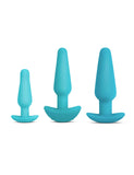 The three plugs from the b-Vibe Anal Training & Education Butt Plug Set in Aqua are shown against a blank background. The plugs are tapered with thin necks and flared, curved bases. They are arranged with the smallest on the left and largest on the right.