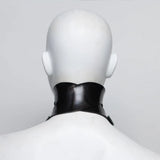 Black rubber posture colllar seen from behings on a mannequin against a white background