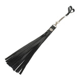 Black rubber flogger with metal details on a white background