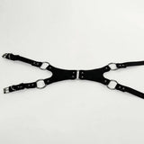 Black Rubber harness laying flat on a white background