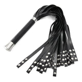 Black rubber flogger with metal handle on a white background