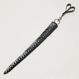 Black rubber feathered edge strap with studs on a white background