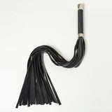 Full view of the Lumina Long Flogger from above on a white background. The falls are arranged in a curve.