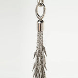 close up of attachment for silver flogger on a white background