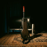 Product shot of the Shredder Fuck Machine sitting upright on a carpet, leaning against a spanking horse.