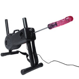 Product shot of the Shredder Fuck Machine against a white background. The machine is at an upright angle on its T-Legs, with a pink dildo on the end of the shaft. 