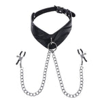 Product shot of the Velvet Noir collar against a white background. It's made of black patterned leather with a metal ring at the front. A chain with adjustable nipple clamps at either end is threaded through the ring.