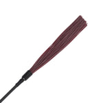 The flogging end of the Saffron Tap and Tickle, showing the short and slim falls that can be used for flogging or tickling. 