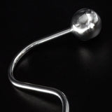 Close-up of the ball on the end of the Steer Hook against a black background. 