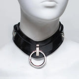 Front of a black rubber collar, showing an O-Ring clipped onto the front attachment point. 