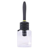 Clear spray bottle with black nozzle on a white background