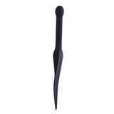 Black silicone tawse on a white background