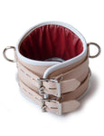 The backside of a Deluxe Padded Medical Posture Collar made with real leather by The Stockroom in Los Angeles is shown on a plain white background. 